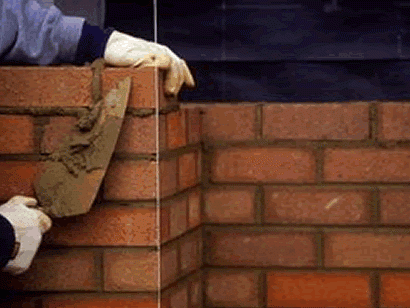 builders laying bricks