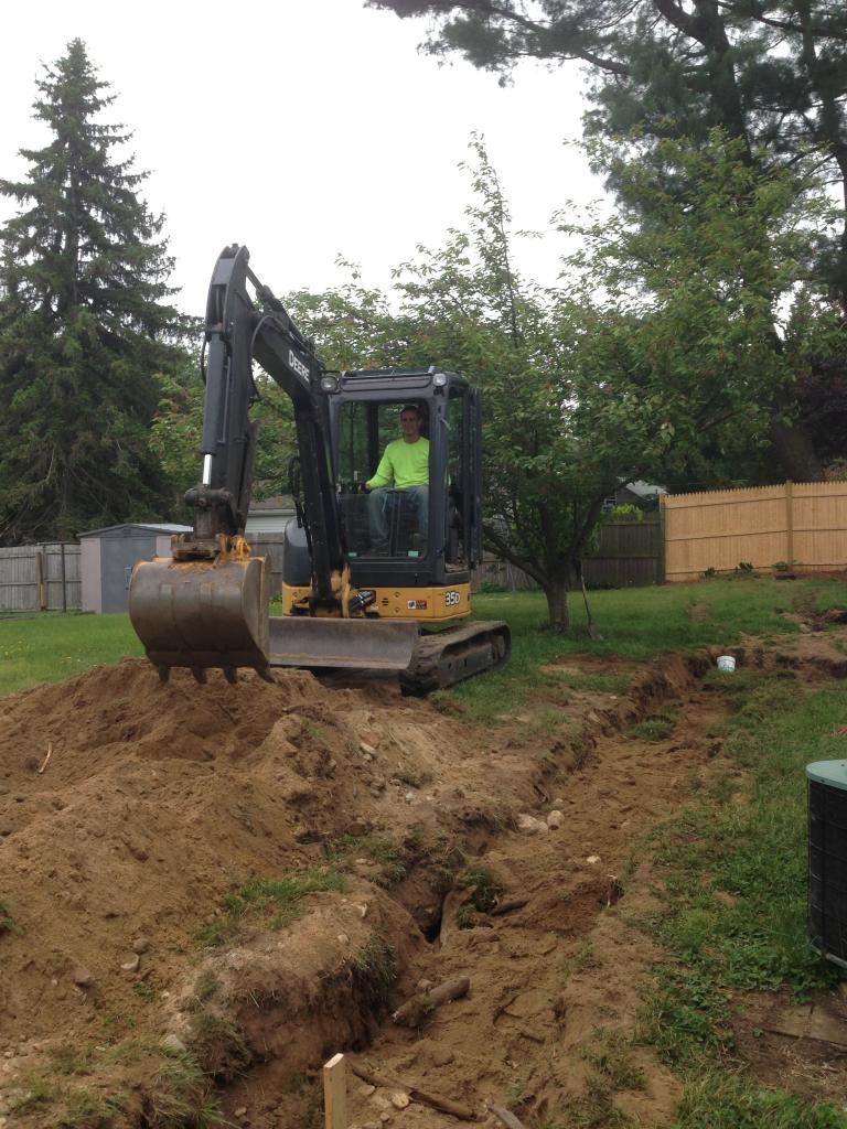 Phil's Excavating backfills trench